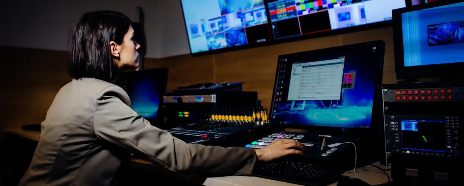 Female TV director control editing room in television studio.Operating ...